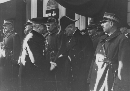 Visit of the Hungarian regent Miklos Horthy in Poland, the welcoming ceremony at the railway station in Cracow, February 5 1938. The regent of Hungary Miklos Horthy shakes the hand of admiral Józef Unrug at the railway platform. Among the generals are also visible: brigade general Janusz Głuchowski (second from the left), division general Aleksander Narbut-Łuczyński (third from the left), brigade general Bernard Mond (fourth from the left). From the collections of the National Digital Archives