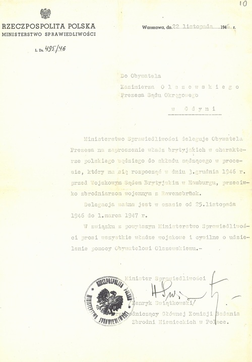 Nominacja Kazimierza Olszewskiego wydana przez ministra sprawiedliwości władz komunistycznych Polski pojałtańskiej w celu wzięcia udziału przez Olszewskiego w charakterze sędziego w procesie członków załogi KL Ravensbrück, jaki miał się rozpocząć 3 grudnia 1946 roku przed Wojskowym Sądem Brytyjskim w Hamburgu. Dokument, wystawiony w Warszawie 22 listopada 1946 roku, podpisał Henryk Świątkowski, obok podpisu którego widnieje odcisk stempla ministerialnego.