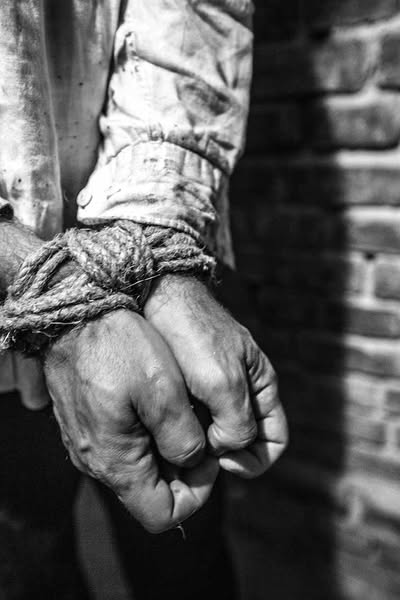 Reenactment. Hands tied. Bemowo Reconstruction and Film Group, photo by C. Pomykało. Photo presented in the 2018 Institute of National Remembrance Archive exhibition entitled “Order No. 00485. Anti-Polish NKVD Operation in Soviet Ukraine 1937–1938”